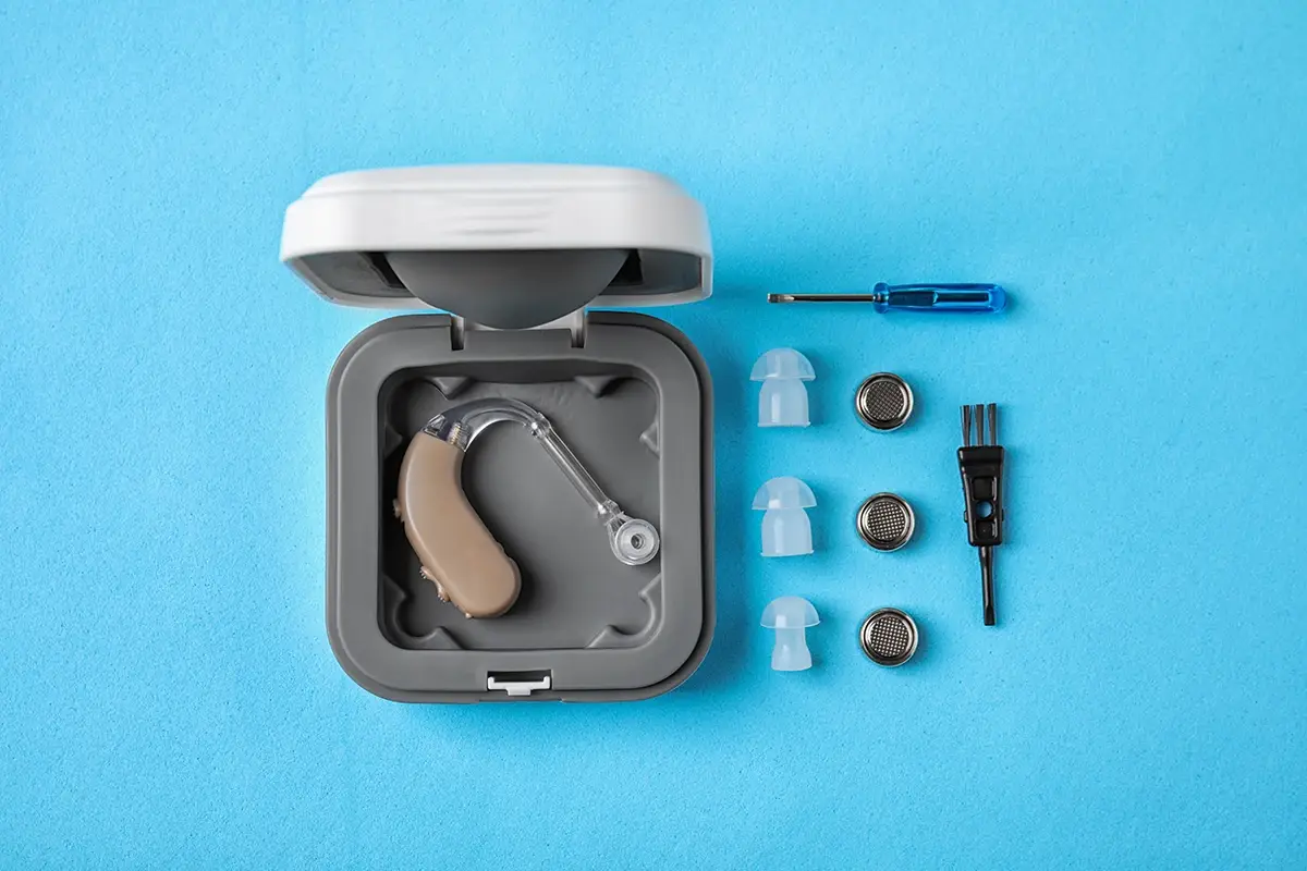 Hearing aid case with domes batteries and cleaning tools